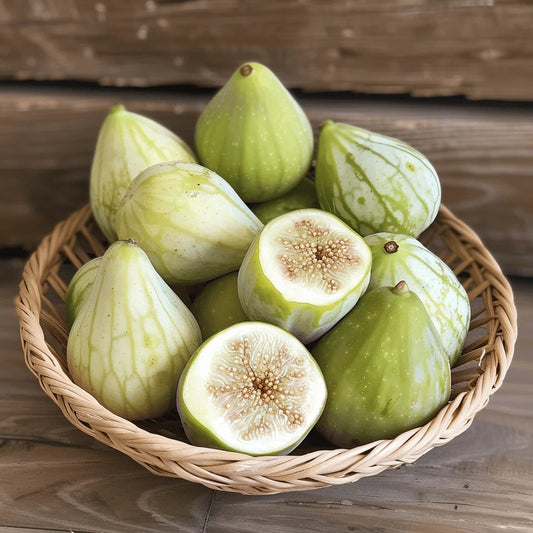 Basket of green Kadota figs with one cut open on a wooden surface